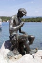 Fisherman's statue in Njivice harbour on island Krk