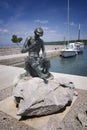 Fisherman's statue in Njivice harbour on island Krk