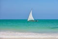 Fisherman sitting in dhow boat sailing blue waters Royalty Free Stock Photo