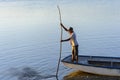 Fisherman sailing with his canoe on the grand Paraguacu river