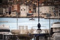 Fisherman sailing out to the sea from the Rovinj port, Croatia at sunset