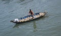 fisherman sailing traditional boat in ca ty river, muine, vietnam