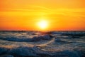 Fisherman sailing with his boat on beautiful sunrise over the sea Royalty Free Stock Photo