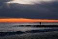 Fisherman on the sea at sunset Royalty Free Stock Photo