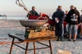 Fisherman selling fish straight from boat after morning catch