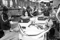 Fisherman selling swordfish to the fish market in Catania, Italy