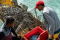 Fisherman selling their raw fish to the water chalet`s kitchen in Egang - Egang Resort,