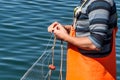 Fisherman sewing nets