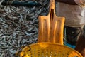 A fisherman with a shovel is preparing to unload a fishing boat. Fishing dock in southern India Royalty Free Stock Photo