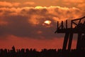 Fisherman silhouette on a old wooden bridge near Sventoji.Stormy evening Royalty Free Stock Photo