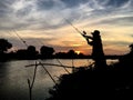 Fisherman silhouette sunset Royalty Free Stock Photo