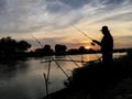 Fisherman silhouette sunset Royalty Free Stock Photo