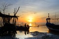 Fisherman are sitting on fishing boat to fix engine