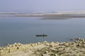 A fisherman sitting on his boat in jamuna river