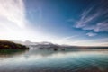 Fisherman in a small boat on a beautiful pristine Alaskan Lake during summer