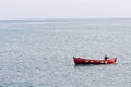 Fisherman in a small fishing boat off Howth harbour in Ireland Royalty Free Stock Photo
