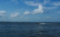 Fisherman speeding along on a lake Royalty Free Stock Photo