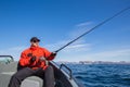 Fisherman sportsman sunglasses fishing in the sea. In the hands