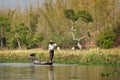 Fisherman standing in a boat on Inle lake, Burma Myanmar