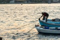 Fisherman Standing on the bow