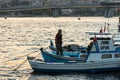 Fisherman Standing on the bow