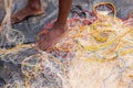 Fisherman standing on hes fishing net