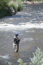 Fisherman standing in the Poudre River fly fishing in Colorado, USA Royalty Free Stock Photo