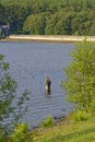 A Fisherman standing in the water of the Fewston Reservoir in West Yorkshire