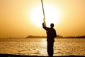 Fisherman at sunset Royalty Free Stock Photo