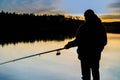 Fisherman at sunset fishing