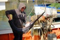 Fisherman and swordfish on a boat