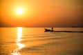 A fisherman takes a small local fishing boat out to fish early in the morning at sea, Rayong Province, Thailand