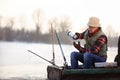 Fisherman taking hot tea while fishing fish