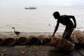 Fisherman taking preparation for fishing by cage and rope on the riverbank