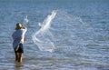 Fisherman throwing a cast net at Karumba.