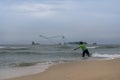 Fisherman throwing a fishing net