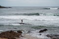 Fisherman is throwing fishing net on Rio Vermelho beach in the city of Salvador, Bahia Royalty Free Stock Photo