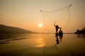 Fisherman throwing fishing net Royalty Free Stock Photo