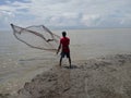 Fisherman throwing a net in Bangladesh.