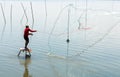 Fisherman throwing net