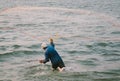 Fisherman throwing a net in India Kerala