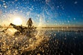 Fisherman throwing net at sunrise , Thailand Royalty Free Stock Photo