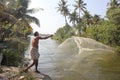 Fisherman throwing out his net