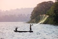 Fisherman throws a net in Lake Victoria