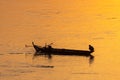 Fisherman on the traditional boat  on the Mekong River in Cambodia Royalty Free Stock Photo