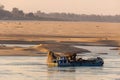 Fisherman on the traditional boat  on the Mekong River in Cambodia Royalty Free Stock Photo