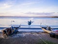 Fisherman with traditional boat returns to the coast after a fishing trip, Bolsena lakeshore, Viterbo province, Lazio, Italy