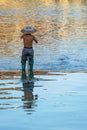 Man catching fish in Fenghuang