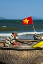 Fisherman on the traditional vietnamese round boat (tung chai). An Bang beach. Hoi An. Vietnam