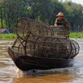 Fisherman with traps, Tonle Sap, Cambodia Royalty Free Stock Photo